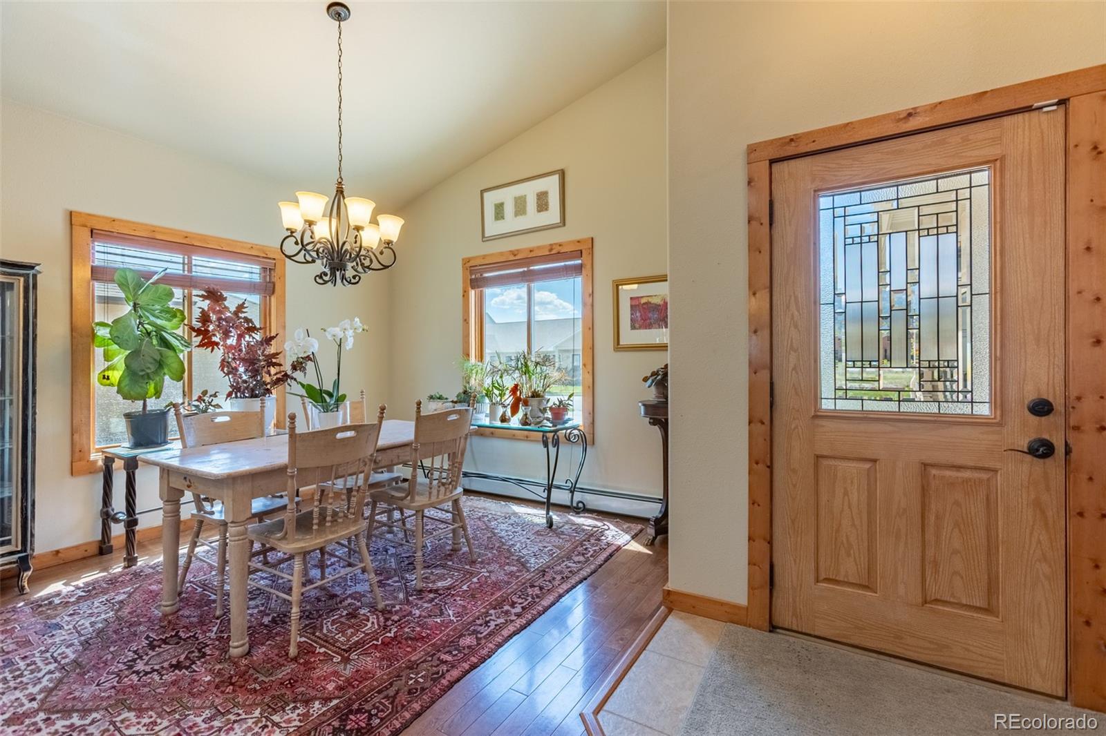 137 Starbuck Circle Salida, CO 81201 - Photo 14 of 50 a view of a dining room with furniture a chandelier and wooden floor