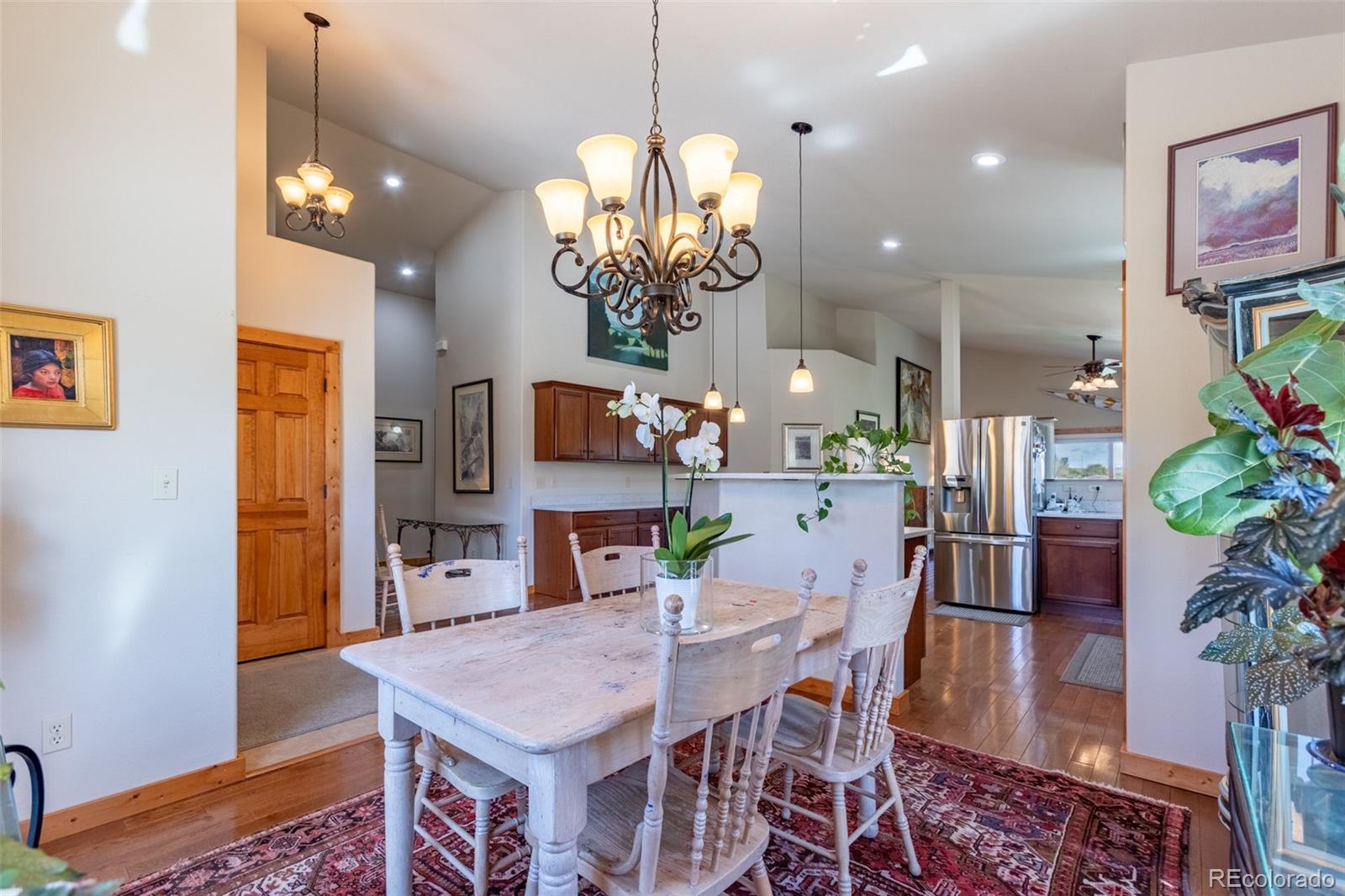 137 Starbuck Circle Salida, CO 81201 - Photo 17 of 50 a view of a dining room with furniture and wooden floor