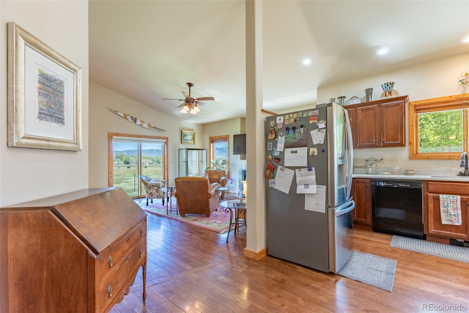 137 Starbuck Circle Salida, CO 81201 - Photo 26 of 50 a living room with stainless steel appliances furniture a fireplace and a kitchen view