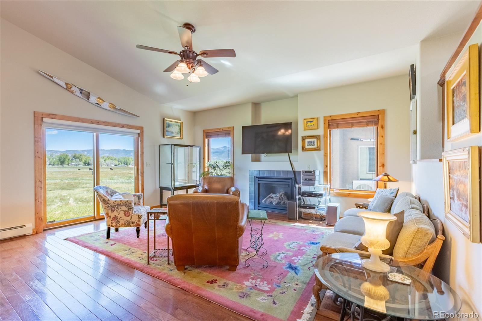 137 Starbuck Circle Salida, CO 81201 - Photo 28 of 50 a living room with furniture a fireplace and a flat screen tv