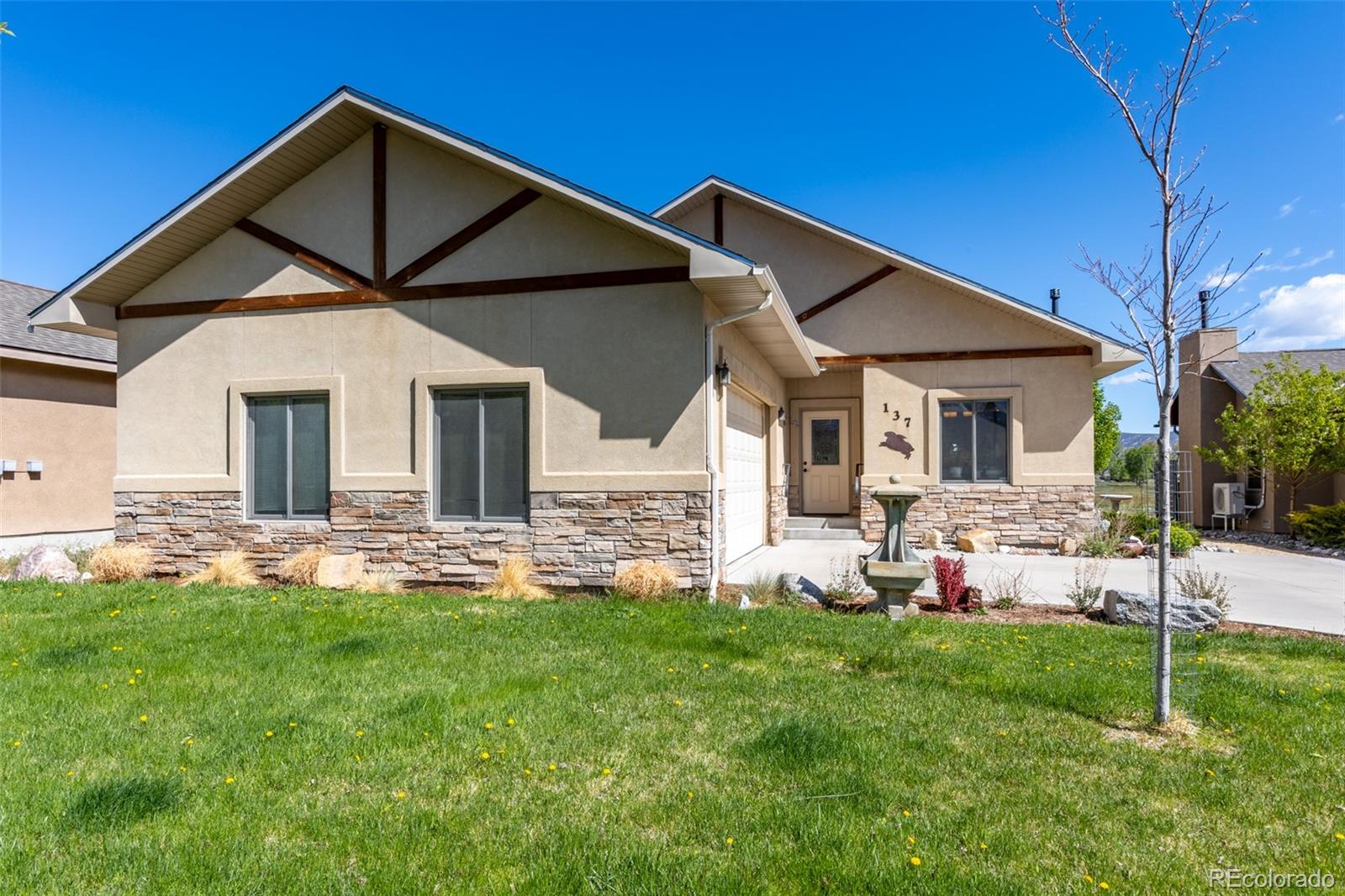 137 Starbuck Circle Salida, CO 81201 - Photo 3 of 50 a front view of a house with a yard and porch
