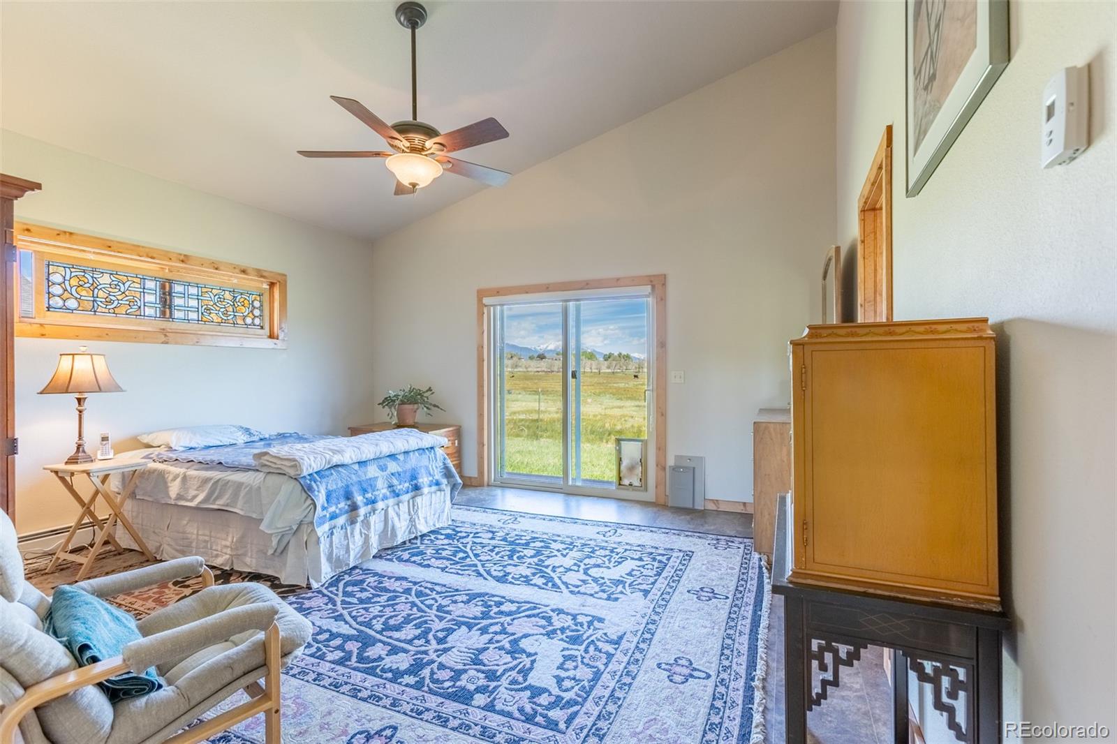 137 Starbuck Circle Salida, CO 81201 - Photo 32 of 50 a bedroom with a bed and wooden floor