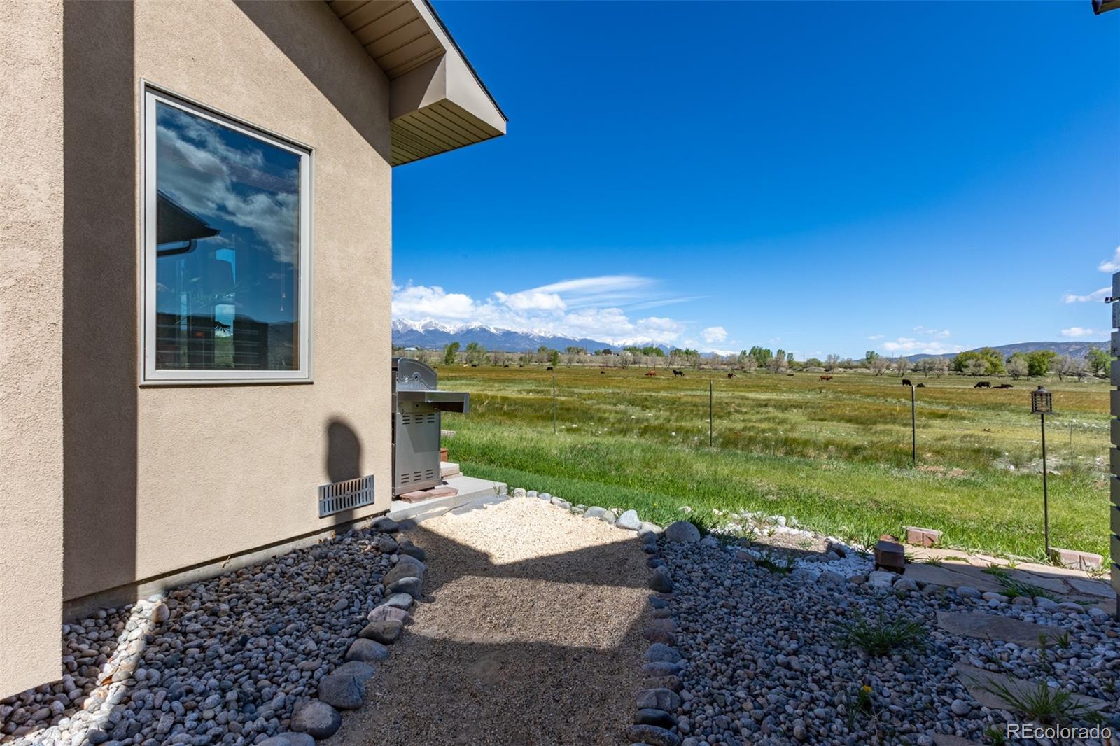 137 Starbuck Circle Salida, CO 81201 - Photo 8 of 50 a view of a backyard with floor to ceiling windows