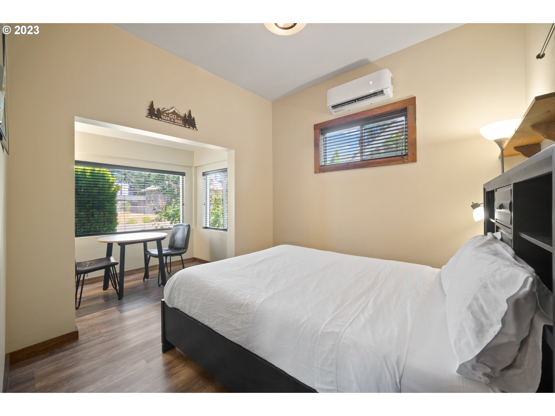 709 West Fourth Plain Boulevard Vancouver, WA 98660 - Photo 12 of 29 a bedroom with a bed and a table