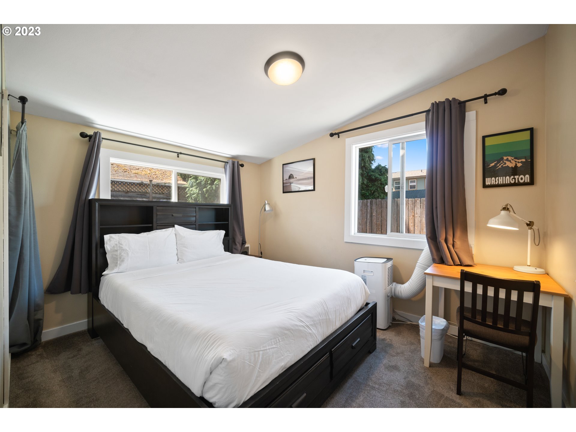 709 West Fourth Plain Boulevard Vancouver, WA 98660 - Photo 16 of 29 a bedroom with a bed and a window