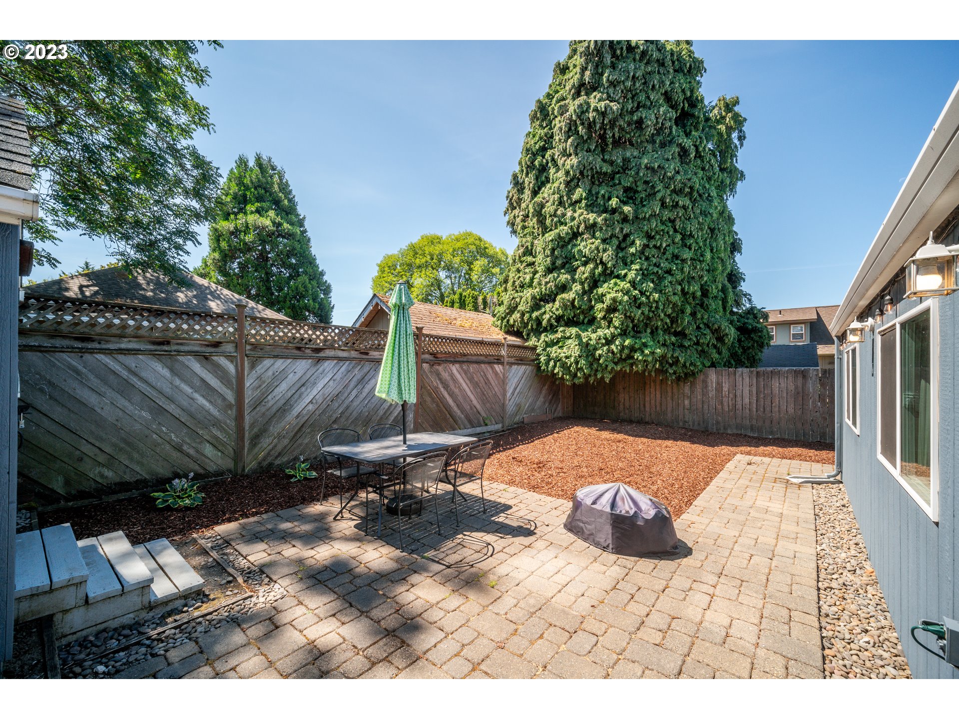 709 West Fourth Plain Boulevard Vancouver, WA 98660 - Photo 23 of 29 a view of backyard with wooden fence and trees