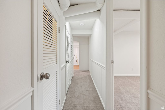 673 East 700 South Springville, UT 84663 - Photo 28 of 43 Interior hallway featuring light gray carpeting, white walls, and wainscoting