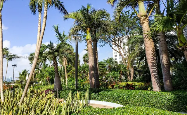 a view of backyard of house with a garden