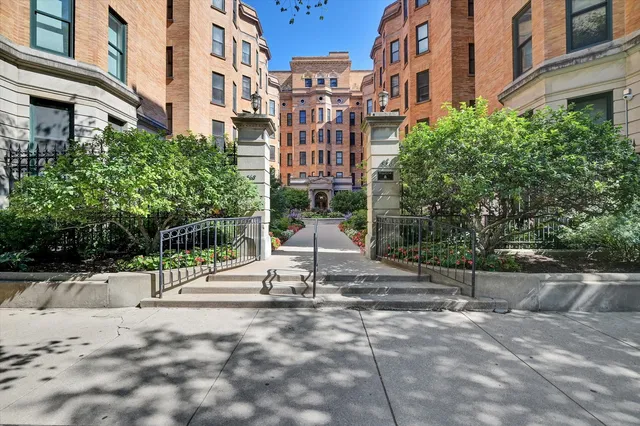 a view of a building with a bench in front of a building