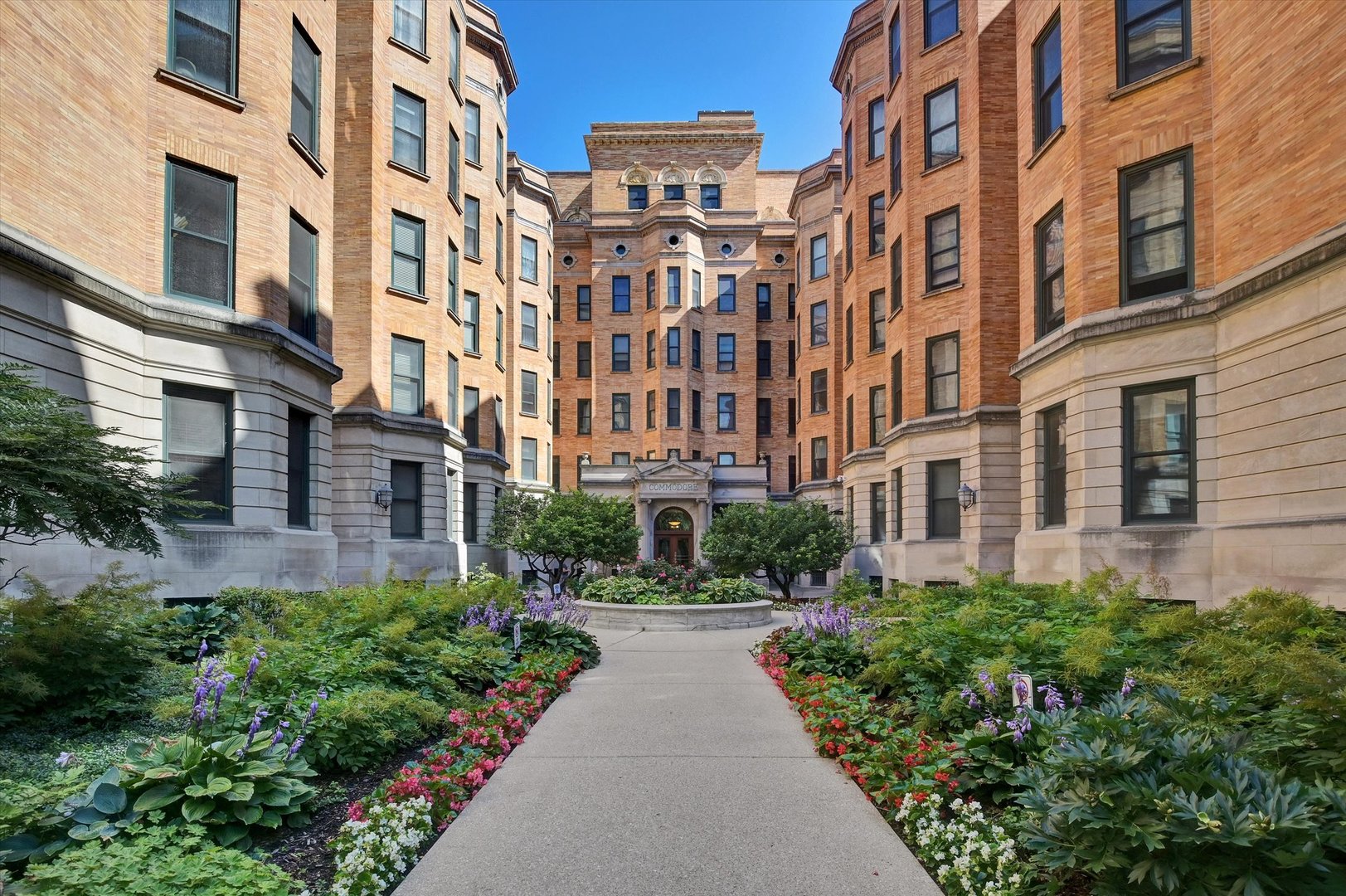 550 West Surf Street, Unit 115 Chicago, IL 60657 - Photo 2 of 18 a view of a building next to a yard