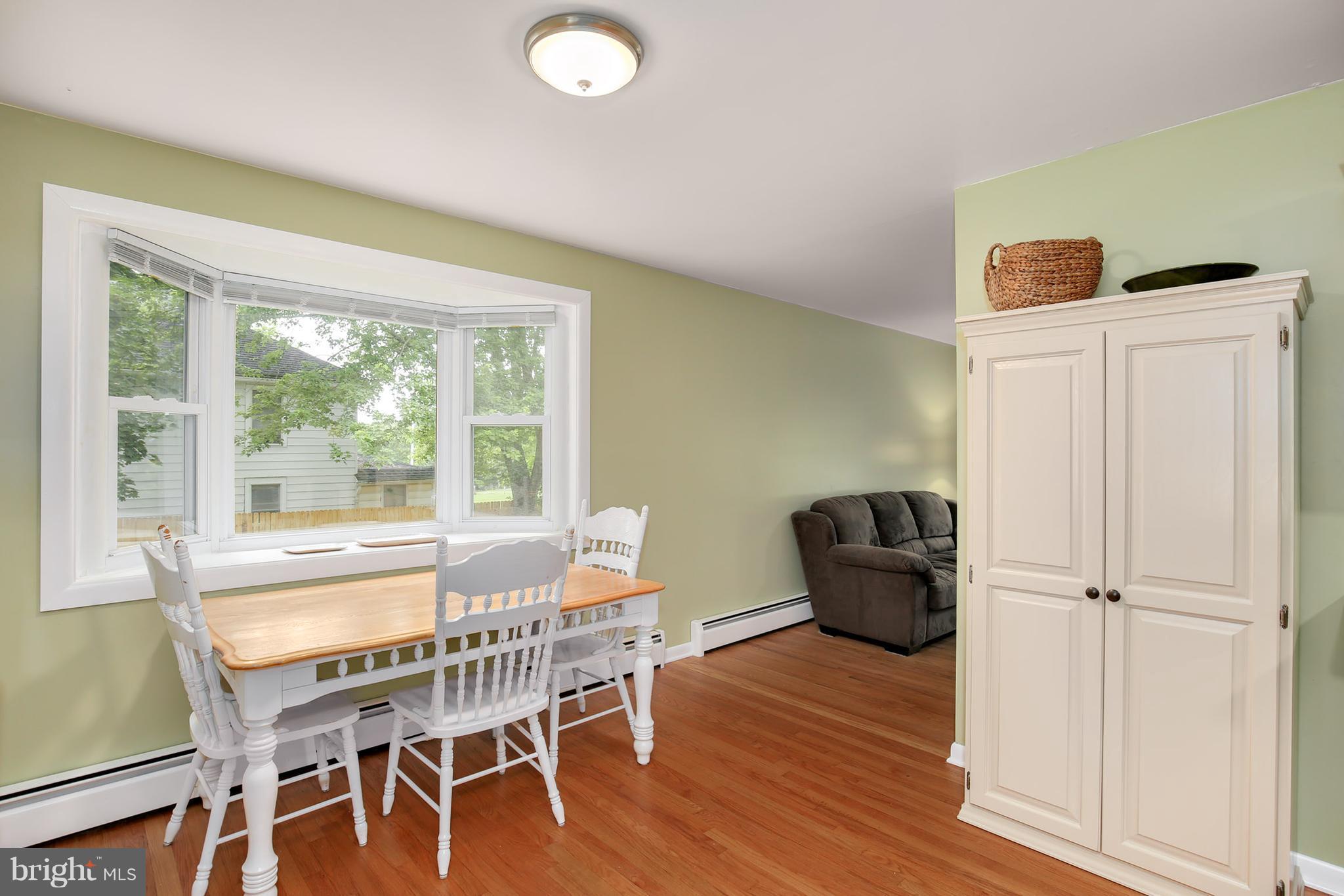 15833 Barnesville Road Boyds, MD 20841 - Photo 8 of 30 a dining room with furniture and wooden floor
