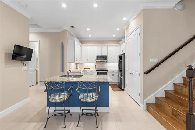 a view of kitchen with microwave and cabinets