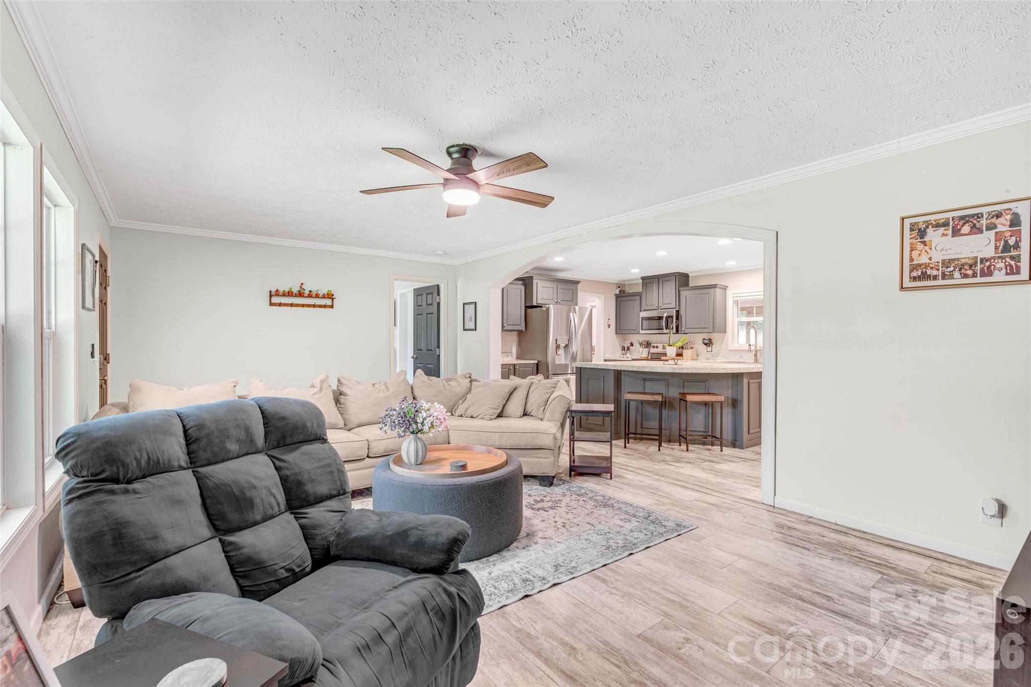 5007 Carlos Road Catawba, NC 28609 - Photo 12 of 29 a living room with furniture a ceiling fan and a window