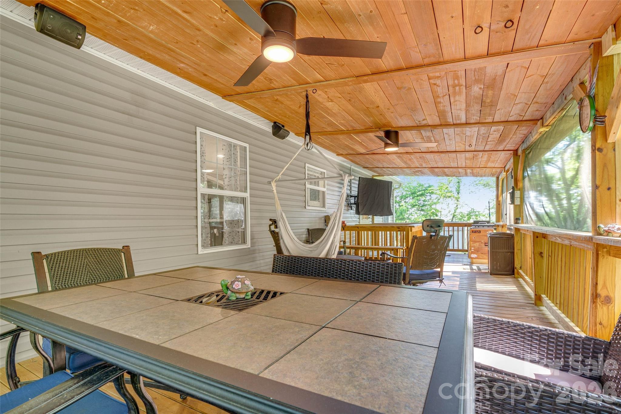 5007 Carlos Road Catawba, NC 28609 - Photo 26 of 29 a view of a patio with table and chairs with wooden floor