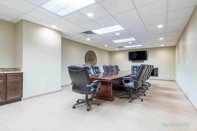 1030 North State Street, Unit 40G Chicago, IL 60610 - Photo 12 of 20 a view of a workspace with furniture and a window