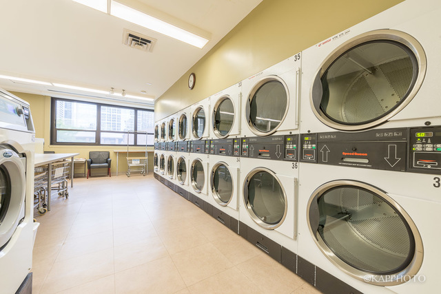 1030 North State Street, Unit 40G Chicago, IL 60610 - Photo 13 of 20 a utility room with multiple dryer and washer