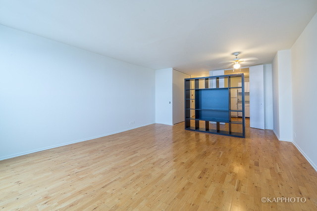1030 North State Street, Unit 40G Chicago, IL 60610 - Photo 3 of 20 a view of a livingroom with furniture and a workspace