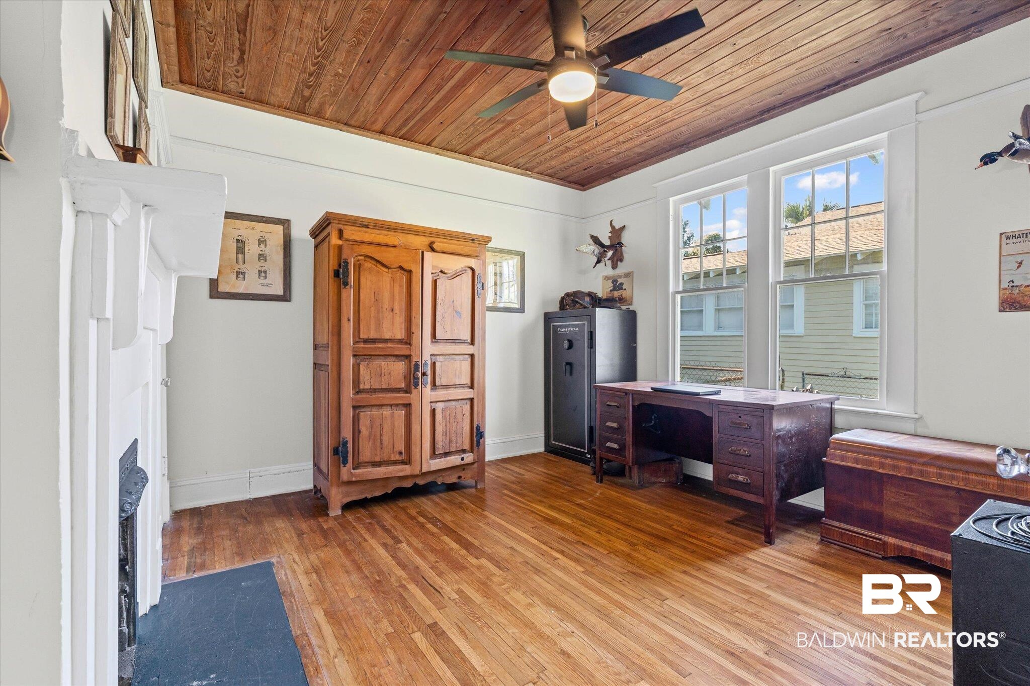 11 South Lafayette Street Mobile, AL 36604 - Photo 13 of 20 Office area featuring light wood-type flooring, wood ceiling, a ceiling fan, and a fireplace with flush hearth