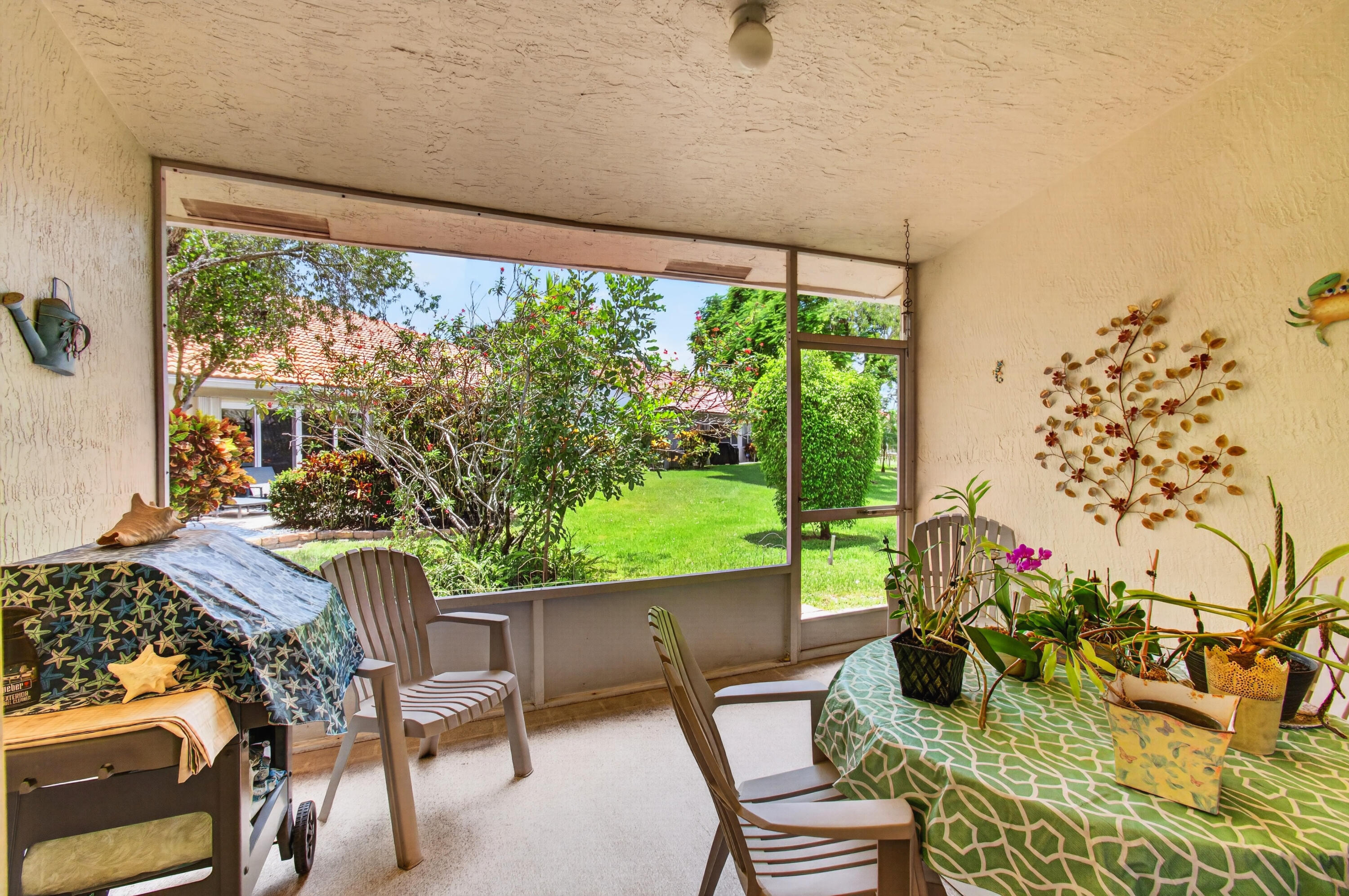 6088 Caladium Road Delray Beach, FL 33484 - Photo 35 of 59 Roofed & Screened Patio