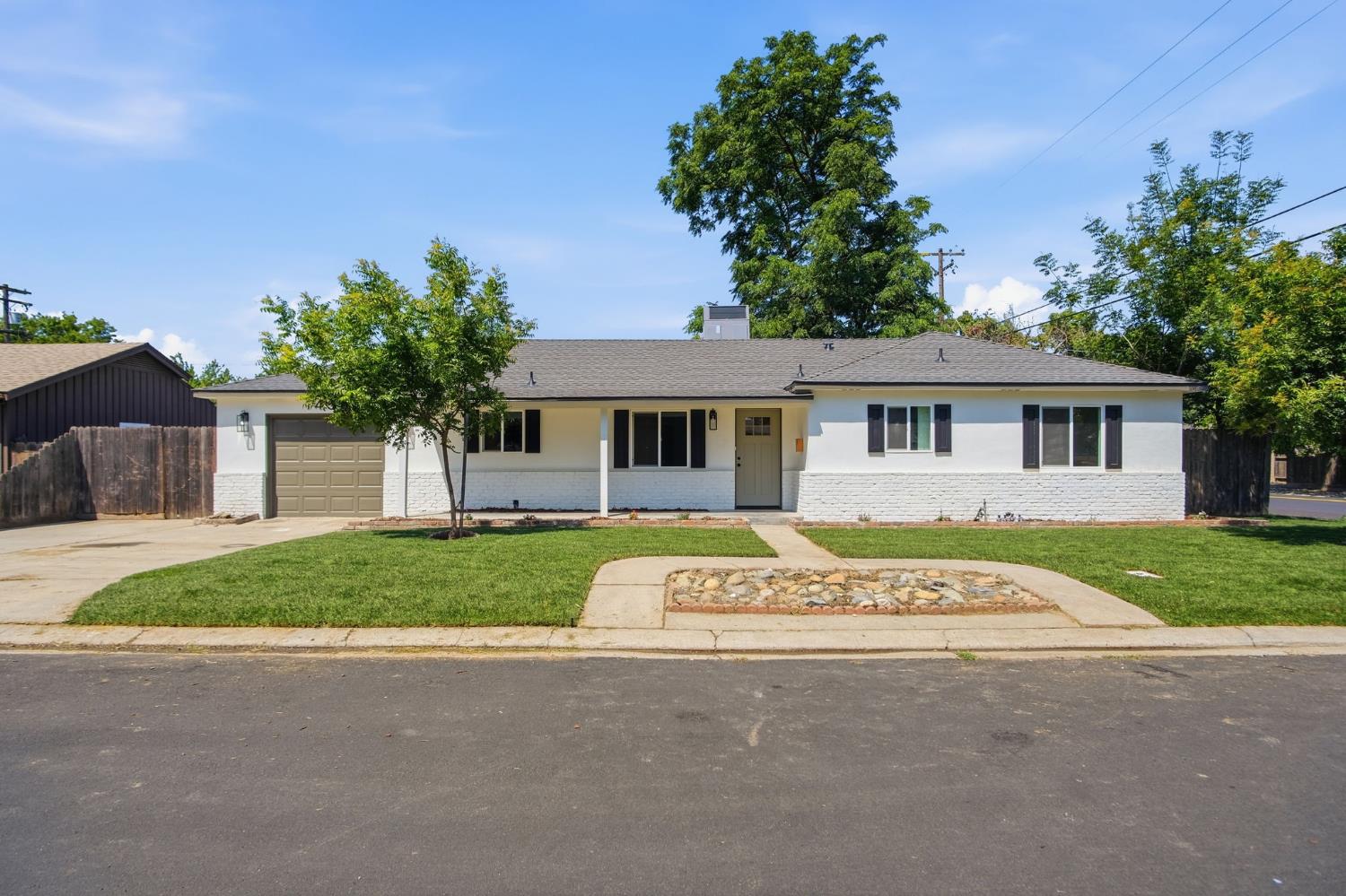 front view of a house with a yard