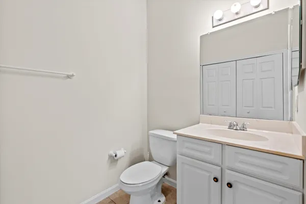 a bathroom with a sink toilet and vanity