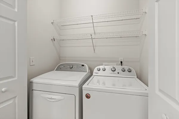 a view of storage and utility room with washer and dryer