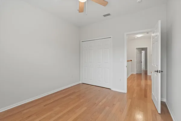 a view of a livingroom with wooden floor