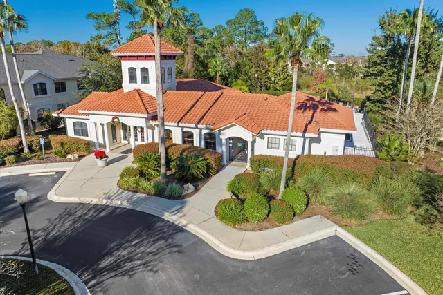 an aerial view of a house with a garden and plants