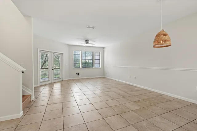 a view of an empty room and a window