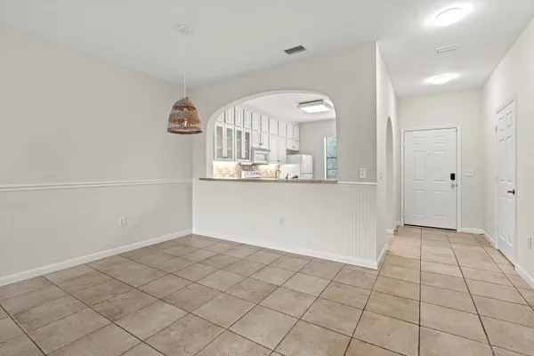 a view of a kitchen cabinets and a window