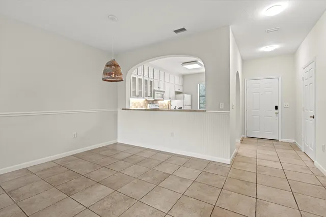 a view of a kitchen cabinets and a window