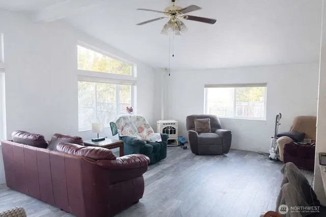 a living room with furniture and a window