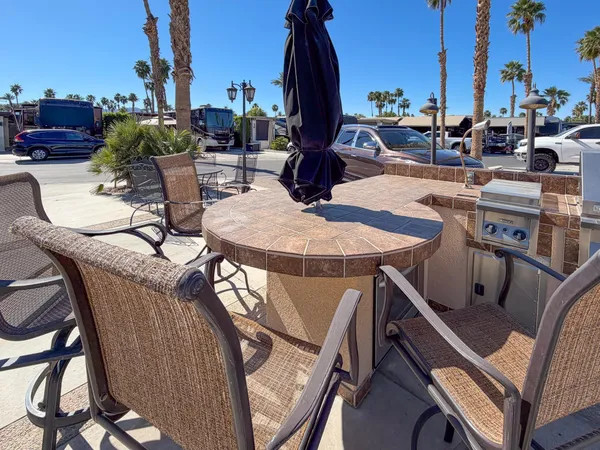 a view of a patio in the backyard