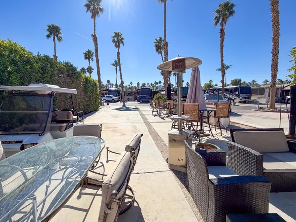 a view of a chairs and tables in patio