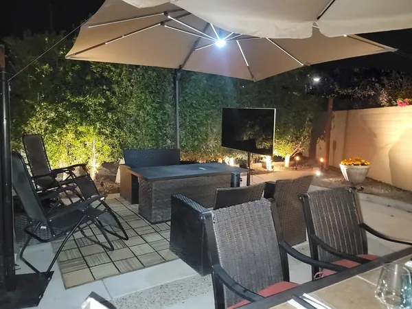 a outdoor space with patio furniture and a umbrella
