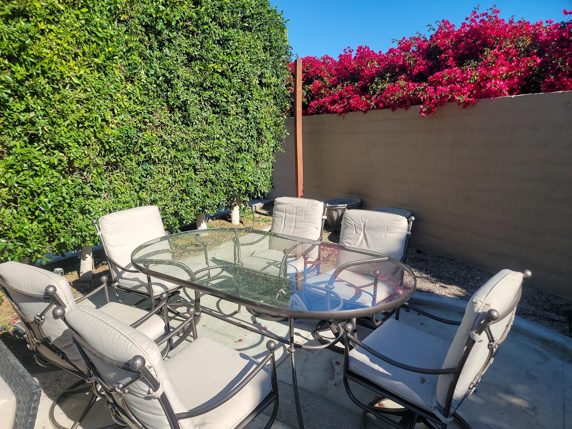 80394 Ave 48, Unit 71 Indio, CA 92201 - Photo 5 of 12 a view of a chairs and table in a backyard