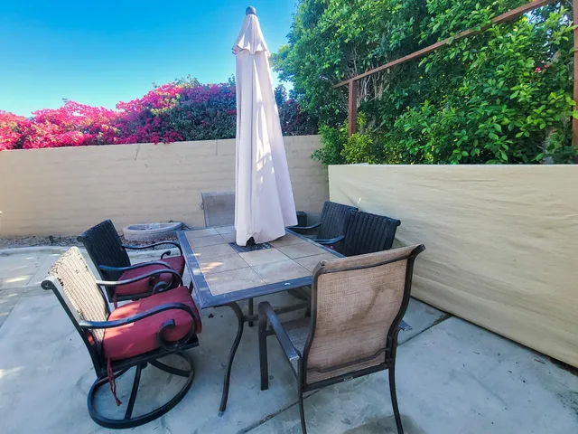 a view of a chairs and table in the terrace