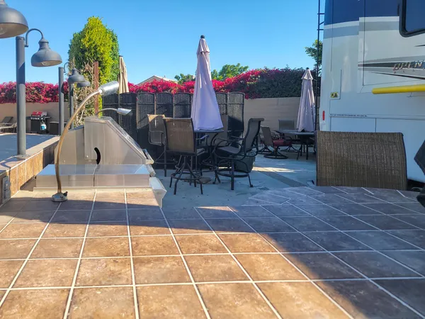 a view of a swimming pool with sitting area