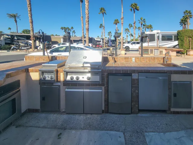 a view of a kitchen with stainless steel appliances