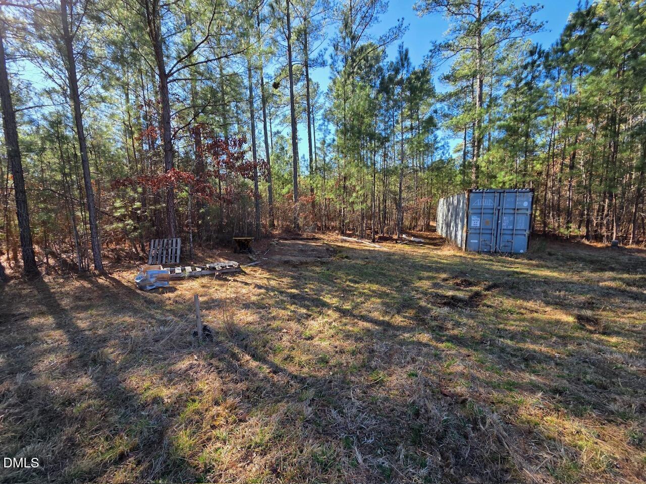 1061 Rogers Quarter Road Creedmoor, NC 27522 - Photo 11 of 11 a view of a yard with trees