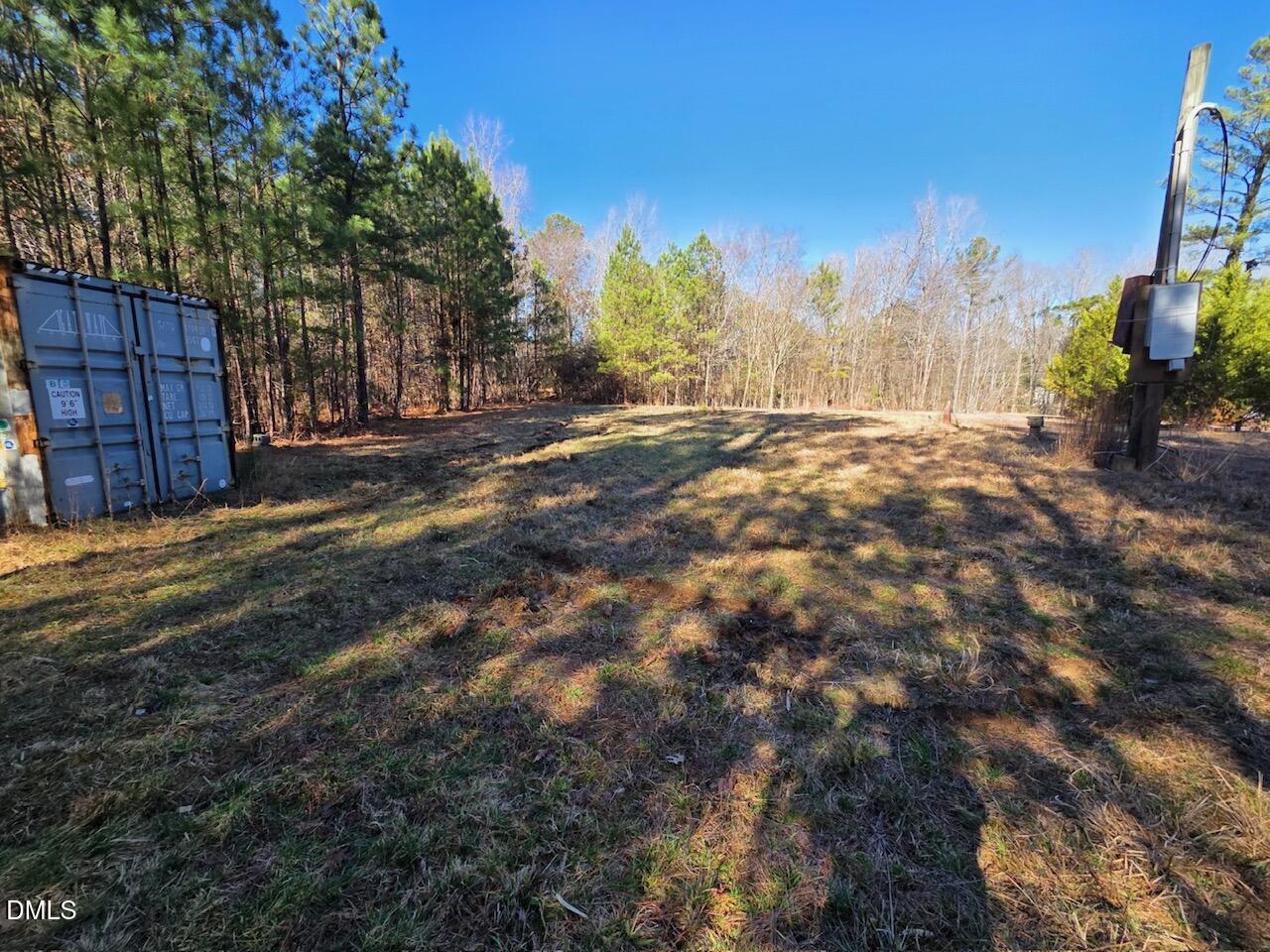 1061 Rogers Quarter Road Creedmoor, NC 27522 - Photo 3 of 11 a view of a yard with wooden fence