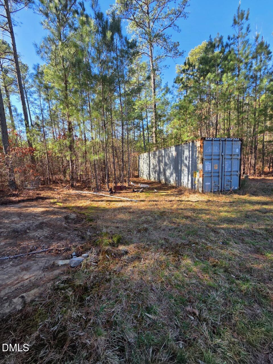 1061 Rogers Quarter Road Creedmoor, NC 27522 - Photo 4 of 11 a view of a yard with large trees