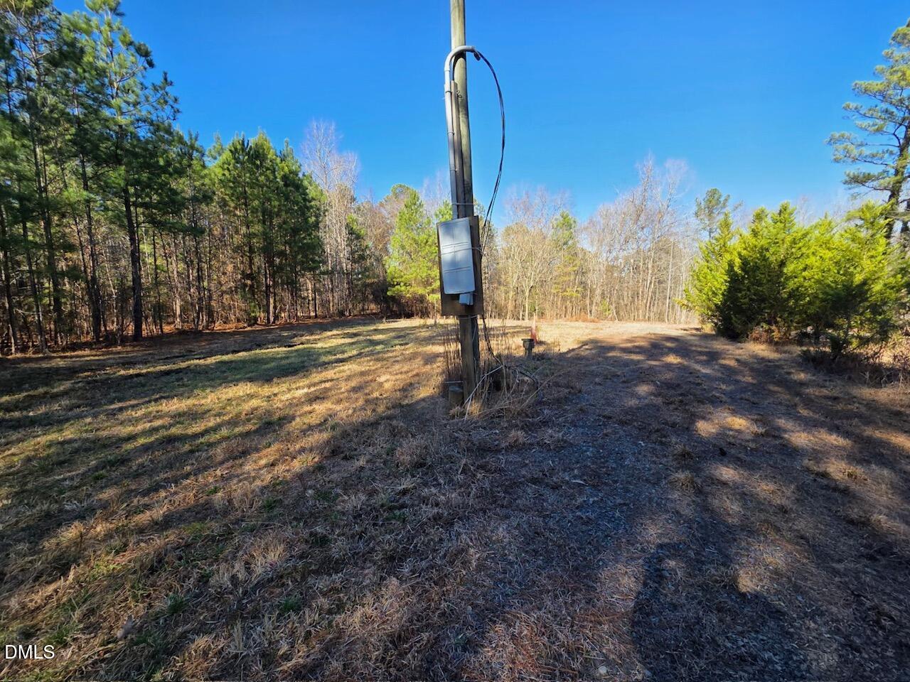 1061 Rogers Quarter Road Creedmoor, NC 27522 - Photo 5 of 11 a view of a street with a building in the background