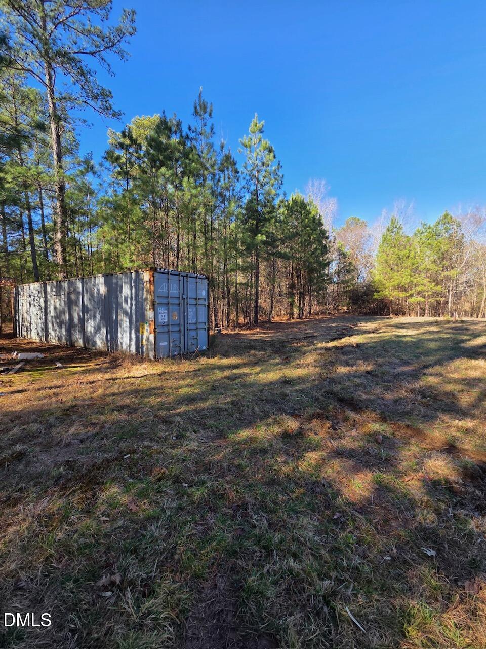 1061 Rogers Quarter Road Creedmoor, NC 27522 - Photo 10 of 11 a view of a yard with plants