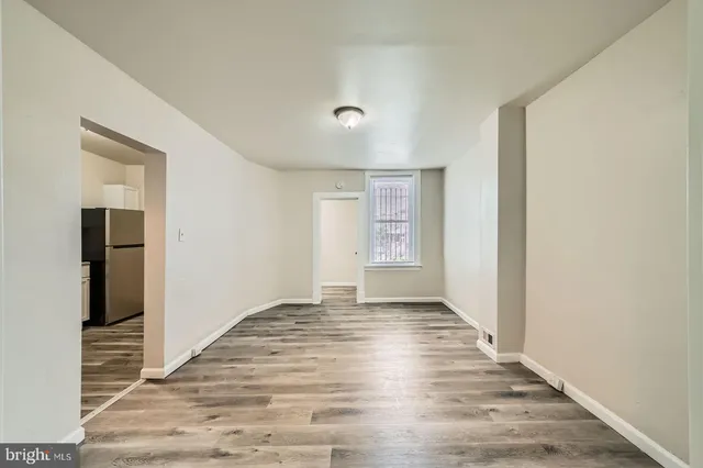 a kitchen with stainless steel appliances granite countertop a stove a refrigerator and a stove