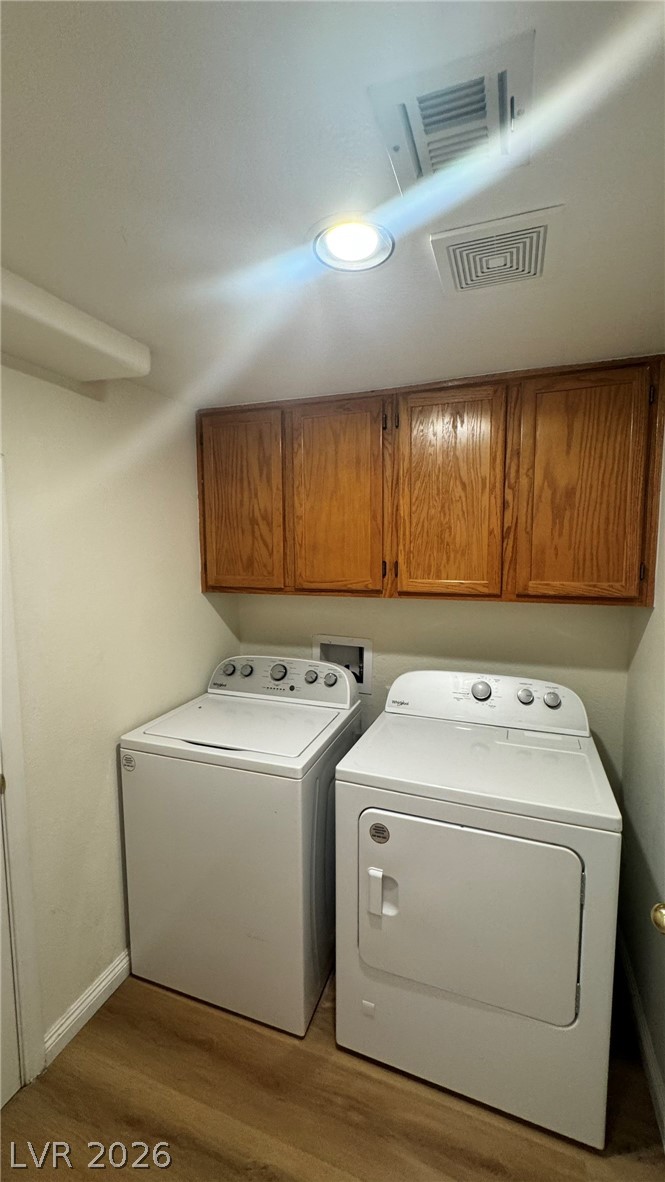 9716 Ridge Creek Place Las Vegas, NV 89134 - Photo 12 of 28 This dedicated laundry space offers convenience with ample storage and durable flooring.