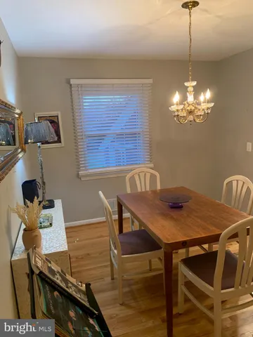 a white toilet sitting next to a shower curtain