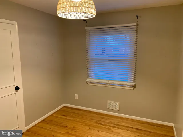 a kitchen with granite countertop a sink stove and cabinets