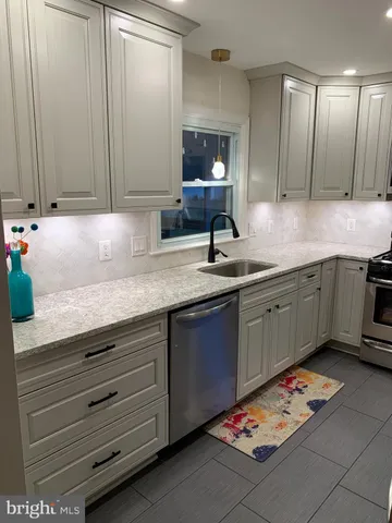 a view of a hallway with paintings on the wall