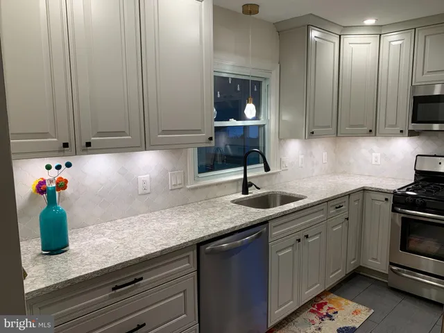 a white toilet sitting next to a window